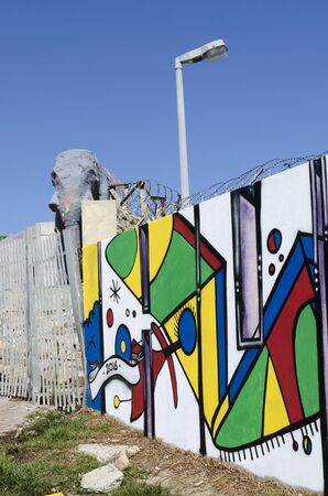 IMIZAMO YETHU TOWNSHIP WESTERN CAPE SOUTH AFRICA - APRIL 2016 - A general view of the Imizamo Yethu township at Hout Bay and the newly painted walls of the exterior fenceのeditorial素材