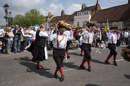 ALRESFORD HAMPSHIRE SOUTHERN ENGLAND UK - MAY 2016  - Traditional Morris dancers perform for the annual Watercress Festival in Alresford a market town in Hampshire England UKのeditorial素材