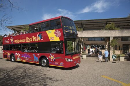 KIRSTENBOSCH WESTERN CAPE SOUTH AFRICA - APRIL 2016 - A red open top double decker tourist bus at the Kirstenbosch Botanic Garden in Cape Townのeditorial素材