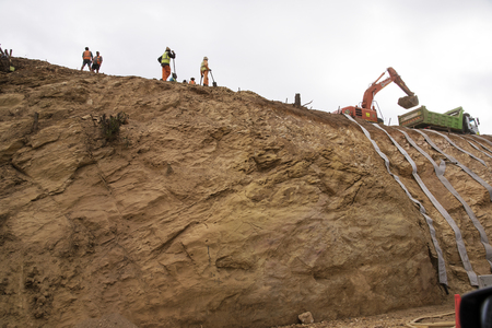 N2 HIGHWAY WESTERN CAPE SOUTH AFRICA - APRIL 2016 - Contractors using straps to retain a earth and rock cutting on the N2 Highway near Elgin in the Weatern Capeのeditorial素材