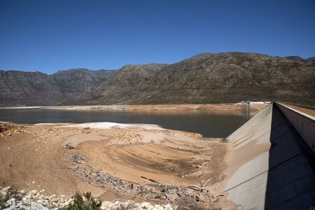 BERG RIVER DAM FRANSCHHOEK WESTERN CAPE SOUTH AFRICA - APRIL 2016 - The dam wall and low water level of the Berg River Dam Reservoir near Franschhoek in the Western Cape Southern Africaのeditorial素材