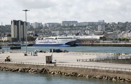 Cherbourg Harbour northern France with  Brittany Ferries Normandie Express fastcat ferry alongside