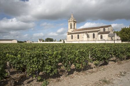 Margaux France - August 2016 - Surrounded with vines the historic Church of Margaux in the Medoc region of Bordeaux Franceのeditorial素材