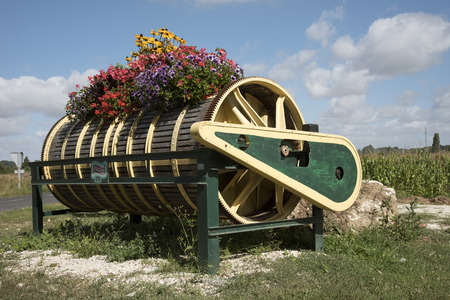 The Loire Valley France - August 2016 - An old wine press decorated in colorful flowers on the roadside at Vouvray in the Loire Franceの写真素材