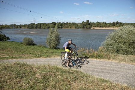 Cyclist Loire River France - August 2016 - Cyclists on a cycleway alongside the River Loire at Chaumont sur Loire Franceのeditorial素材