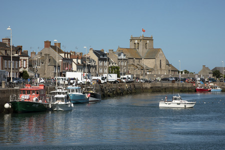 The coastal commune of Barfleur in Normandy northwest France. Boats berthed in the small harborのeditorial素材