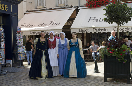 Amboise France - August 2016 - For women in period costume walking in the old town center of Amboise situated along the Loire valleyのeditorial素材
