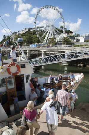 The passenger ferry Western Lady III which operates in the summer season between seaside towns of Brixham and Torquay. The ferryboat is seen here in Torquay with passengers boarding the vesselのeditorial素材