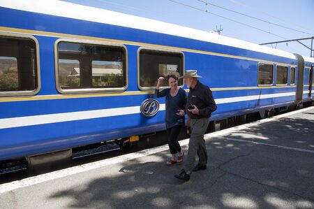 Matjiesfontein in the Central Karoo region of the Western cape South Africa. Rail passengers on the station platform with the luxury Blue Trainのeditorial素材