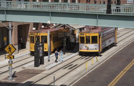 Uptown and downtown streetcars at Ybor Centro stop. Tampa Florida USA May 2017のeditorial素材