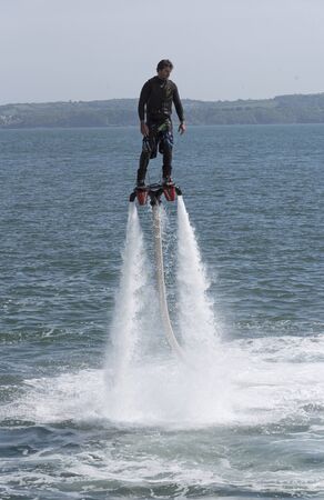 Man flyboarding on the south west coast at Torquay South Devon England UK. May 2017のeditorial素材