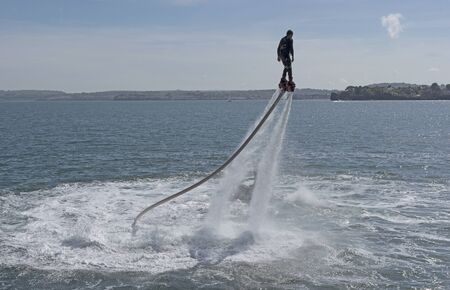 Man flyboarding on the south west coast at Torquay South Devon England UK. May 2017のeditorial素材