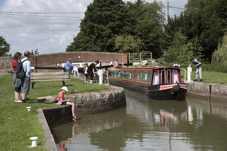 Boating activity at Moonrake Lock on the Kennet & Avon Canal in Devizes Wiltshire UK.のeditorial素材