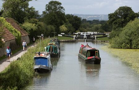 Narroboat underway on the Kennet & Avon Canal near Devizes Wiltshire UKのeditorial素材