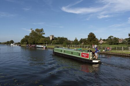 The Gloucester & Sharpness Canal at Frampton on Severn in Gloucestershire England UK. August 2017. Boats on the canal on a summer dayのeditorial素材