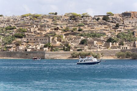 Passenger ferry off Spinalonga Island a former Leper Colony in northern Crete, Greece. October 2017のeditorial素材
