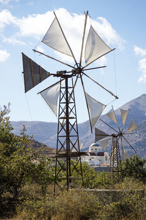 Windmill and church at Agios Georgios on the Lasithi plateau, Crete, Greece. October 2017のeditorial素材