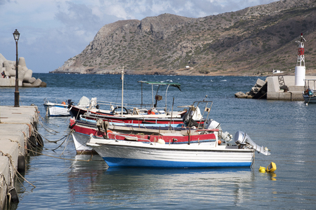 Milatos, Crete, Greece. 2017. The small fishing harbour with mountains joining the Sea of Crete.のeditorial素材