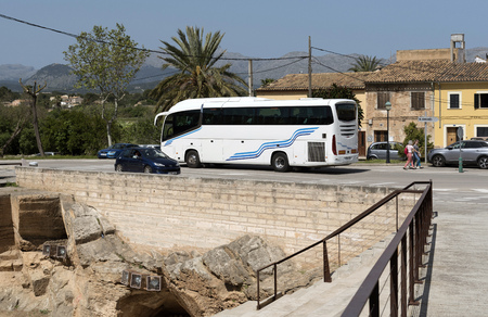 Alcudia, Mallorca, Balearic Island, Spain. 2018. Tourbus passing the Bastioin and bridge of Villa Rioja thestre in Alcudia old quarterのeditorial素材