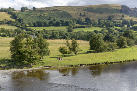 The River Dee at Carrog, Denbighshire, North Wales, Scenic location on the riverside looking southern farmland.のeditorial素材