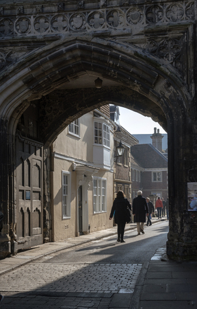 Salisbury, Wiltshire, England, UK. March 2019. Visitors passing through the North Gate of the city...