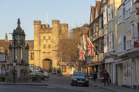 Wells, Somerset, England, UK. March 2019. Glowing sun illuminates the Market Place,and Bishops Eye Gatehouse in the cathedral city in the Mendip district of Somerset.のeditorial素材