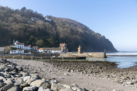 Lynmouth, North Devon, England, UK. March 2019. Lynmouth pier on the West Lyn River with the historic Rhenish Towerのeditorial素材