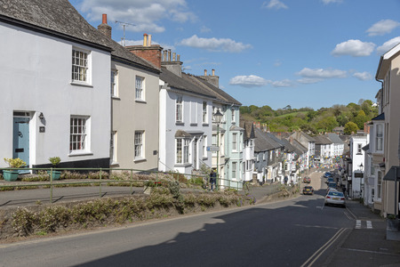 Modbury, South Devon, England, UK. May 2019. The market town of Modbury viewed from the west looking downhill to the town centreのeditorial素材