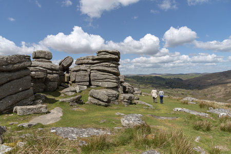 Dartmoor National Park, Devon, England, UK, May 2019. Females tourist visit the Combestone Tor on Dartmoor, Devonのeditorial素材