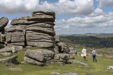Dartmoor National Park, Devon, England, UK, May 2019. Females tourist visit the Combestone Tor on Dartmoor, Devonのeditorial素材