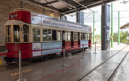 Seaton, Devon, England, UK.  Tramcar number 12 in the Seaton Tramway Station, the car was built in Eastbourne and rebuilt as an open topper in 1980. Used to transport passengers along the River Axe  to Colyton.のeditorial素材