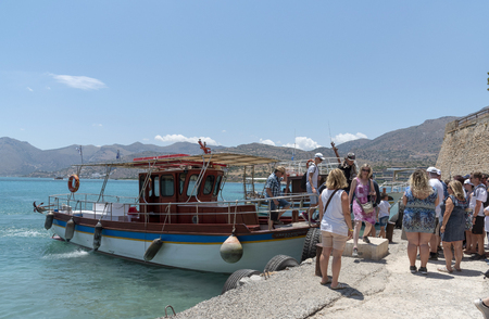 Spinalonga Island, Crete, Greece. June 2019.Small passenger ferry transporting tourists to Spinalonga a former Leper Colony.のeditorial素材