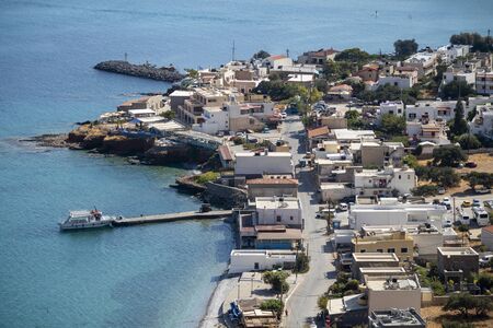 Plaka, Crete, Greece. October 2019, Plaka, an overview of the town and jetty where ferries leave for...