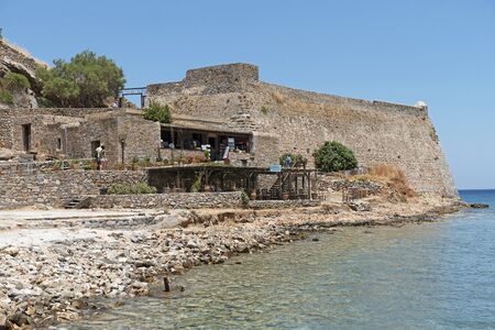 Spinalonga island, Crete, Greece. June 2019. Fortifications, cafe and snack bar, on the former Leper Colony, Spinalonga situated in the Gulf of Mirabello, Creteのeditorial素材