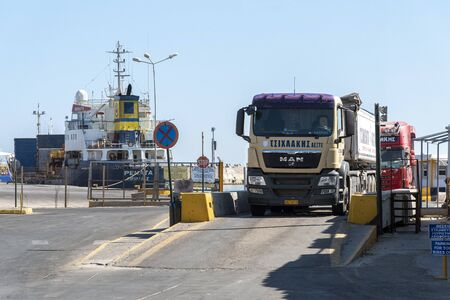 Rethymno, Crete, Greece. September 2019. Trucks entering and exiting the port at Rethymno, Crete,...