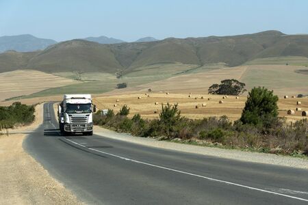Caledon, Western Cape, South Africa. December 2019. Haulage vehicle hauling grain at harvest time in the wheatlands region close to Caledon,のeditorial素材