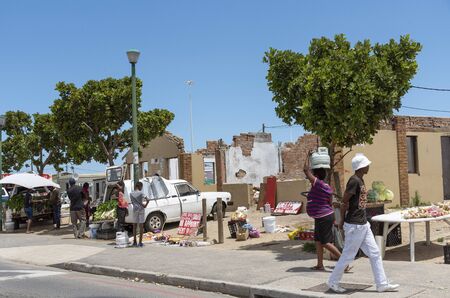Zwelihle, Hermanus, Western Cape, South Africa. Dec 2019. Traders selling fruit and vegetables on...