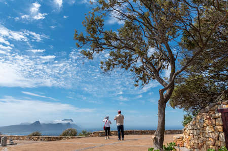 Cape Point, Western Cape, South Africa. Dec 2019. Visitors at Cape Point in the Table Mountain National Park, South Africa. Looking along the coast on a summers day.のeditorial素材