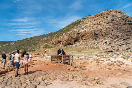 Cape of Good Hope, Western Cape, South Africa, Dec 2019. Tourists being photographed at a Cape of Good Hope sign at this world famous landmarkのeditorial素材
