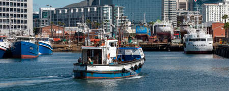 Cape Town, South Africa. 2019. Commercial fishing boat  about to berth on Alfred Basin at the V&A Waterfront , Cape Town, South Africa.のeditorial素材