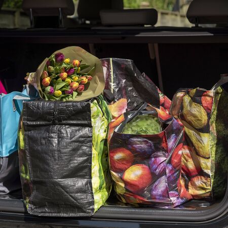Shopping bags and the weekly shop in boot of a car.の写真素材