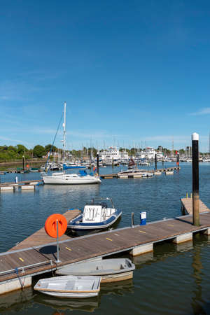Lymington, England, UK. May 2020.  Berthing pontoon and small boats at the Town Quay, Lymington, Hamshire, England UKのeditorial素材