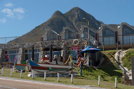 Kleinmond, Western Cape, South Africa. December 2019. Kleinmond on the garden route, South Africa. A popular small town overlooked by the Hottentots-Holland mountais. Cafe and holiday apartmentsのeditorial素材