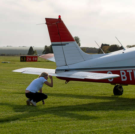 Gloucestershire, England, UK. 2020. A student about to take a flying lesson with her instructor from...