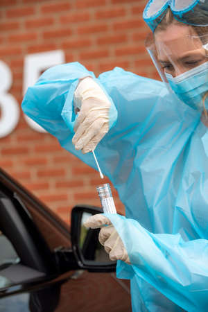 Salisbury, Wiltshire, England, UK. August 2020. portarit of a woman Covid-19 tester wearing...