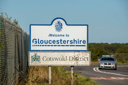 Kemble, Gloucestershire, England, UK. 2020.  Road sign for the county border of Gloucestershire in the Cotswold district. Popular tourist area.のeditorial素材