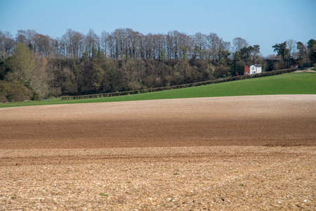 Hampshire, England, UK. 2021. Spring and  a farmers field ready to be seeded at Micheldever near Winchester, England, UKのeditorial素材