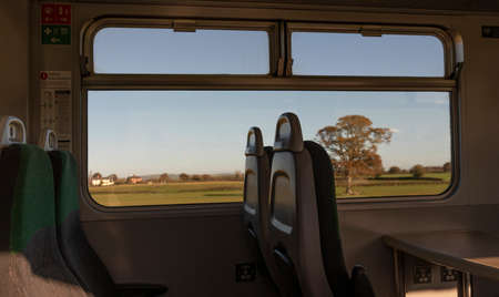 Devon, England, UK. 2021.  Passenger train seating with a view as the train passes Devonshire countryside. The Dartmoor Line.の写真素材