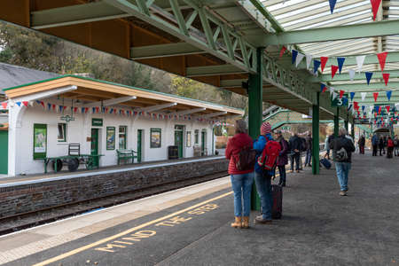 Okehampton, Devon, England, UK. 2021.   Okehampton Station,  with passengers waiting for the...