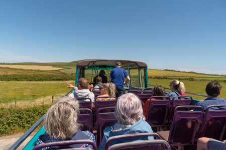 Cornwall, England, UK. 2022. Passengers travelling on a open top tourist bus in the Cornish countryside close to St Just. UKのeditorial素材